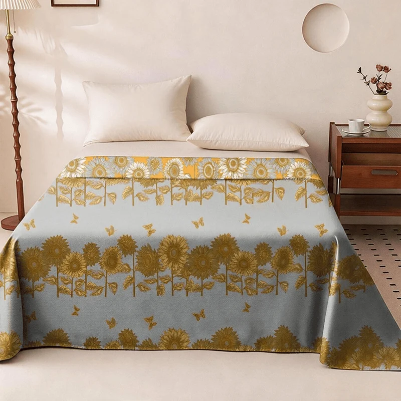 Wendbare Tagesdecke aus Baumwollgaze mit Sonnenblumen- und Schmetterlingsmotiven