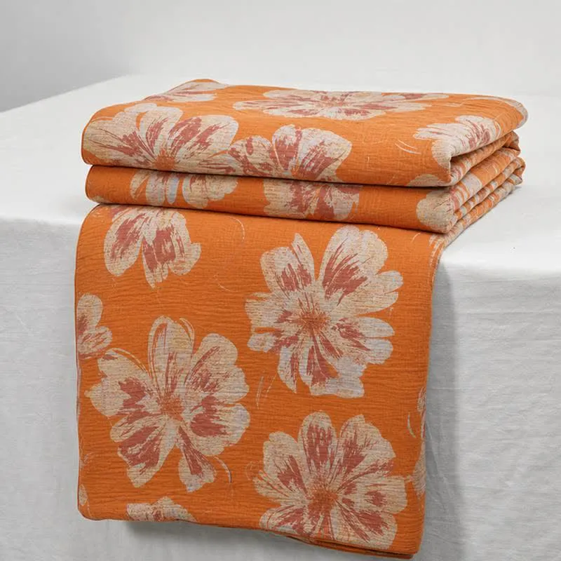 Wendbare Baumwolldecke mit orange-blauem Blumenmuster