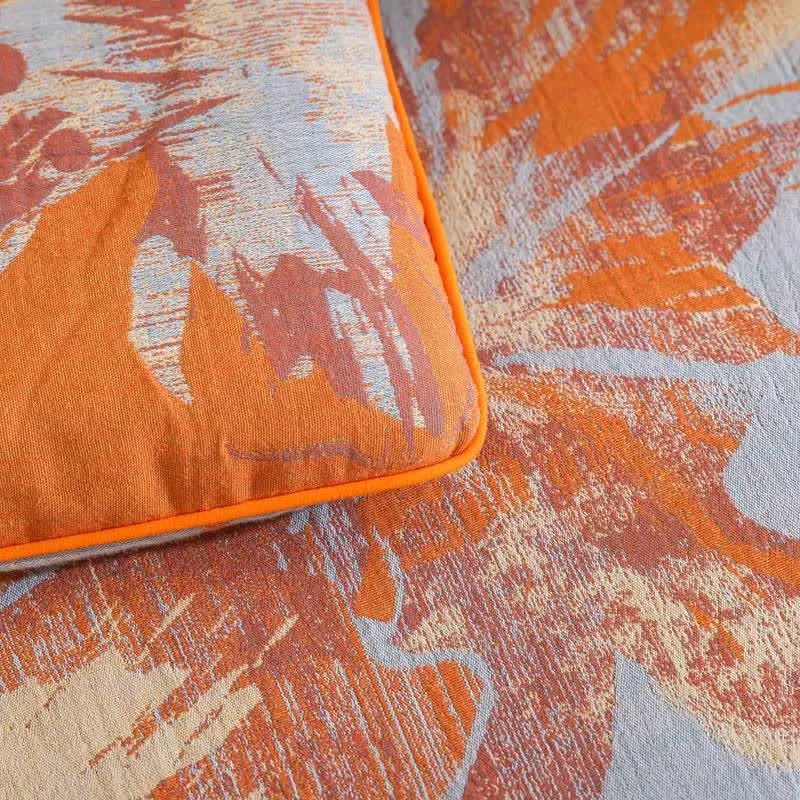 Wendbare Baumwolldecke mit orange-blauem Blumenmuster