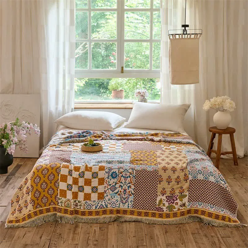 Wendbare Boho-Patchwork-Musselindecke
