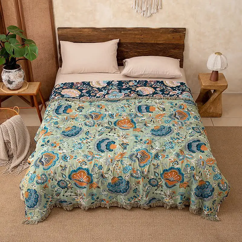 Boho-Sofadecke aus Baumwolle mit Blumenmuster und Quasten