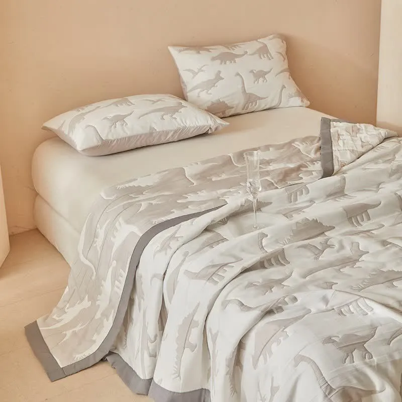 Wendbare Tagesdecke mit neutralem Dinosaurier-Print