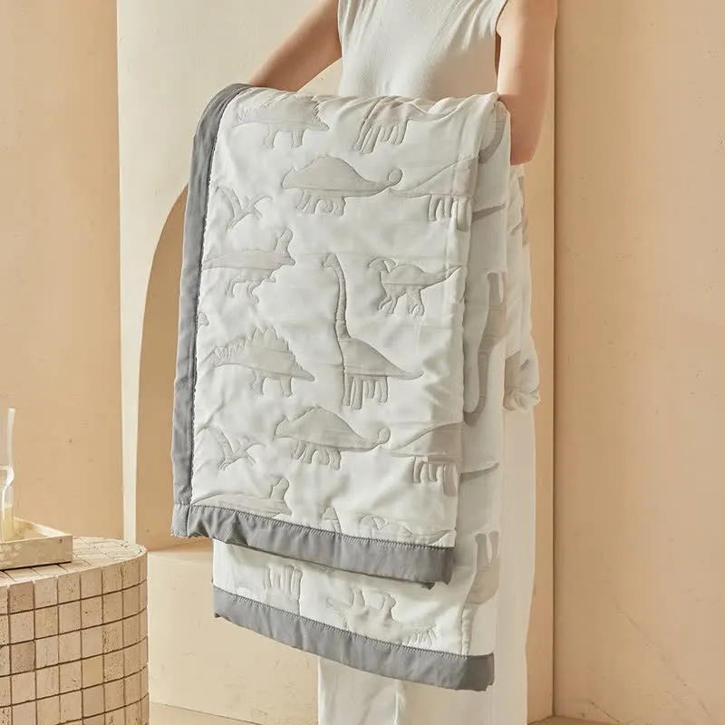 Wendbare Tagesdecke mit neutralem Dinosaurier-Print