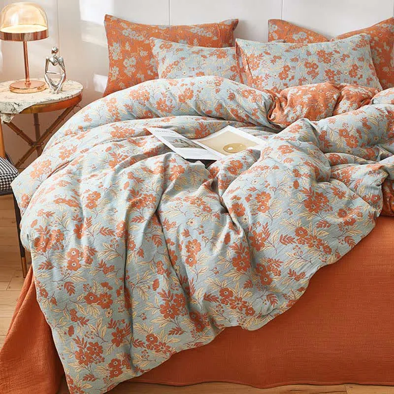 Bettwäsche aus orangefarbenem Baumwoll-Doppelgaze mit Blumenmuster