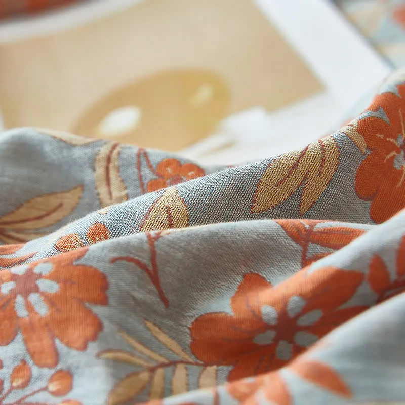 Bettwäsche aus orangefarbenem Baumwoll-Doppelgaze mit Blumenmuster