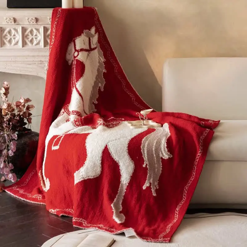 Festliche Strickdecke mit Pferdemotiv