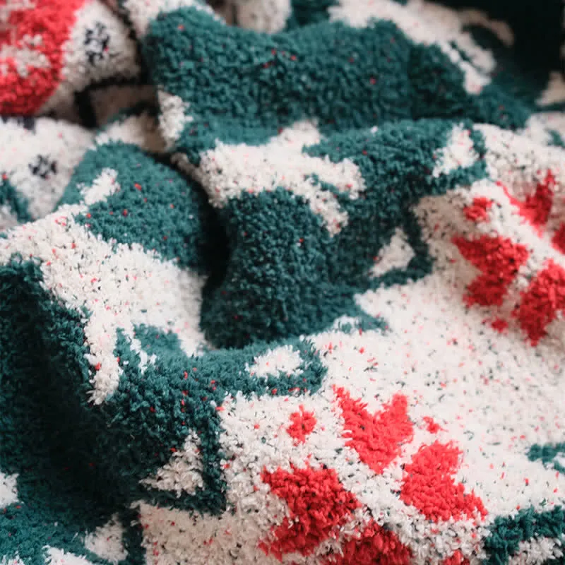 Weihnachtsdecke mit Rentiermotiv im Fair-Isle-Stil