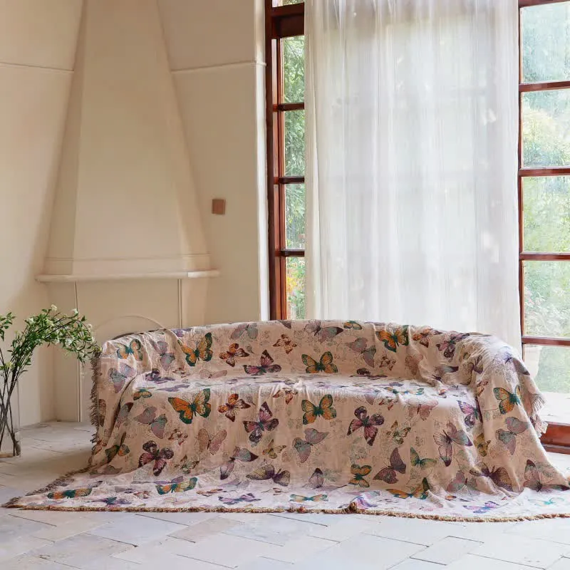 Elegante Sofadecke aus Baumwolle mit Schmetterlingsquasten