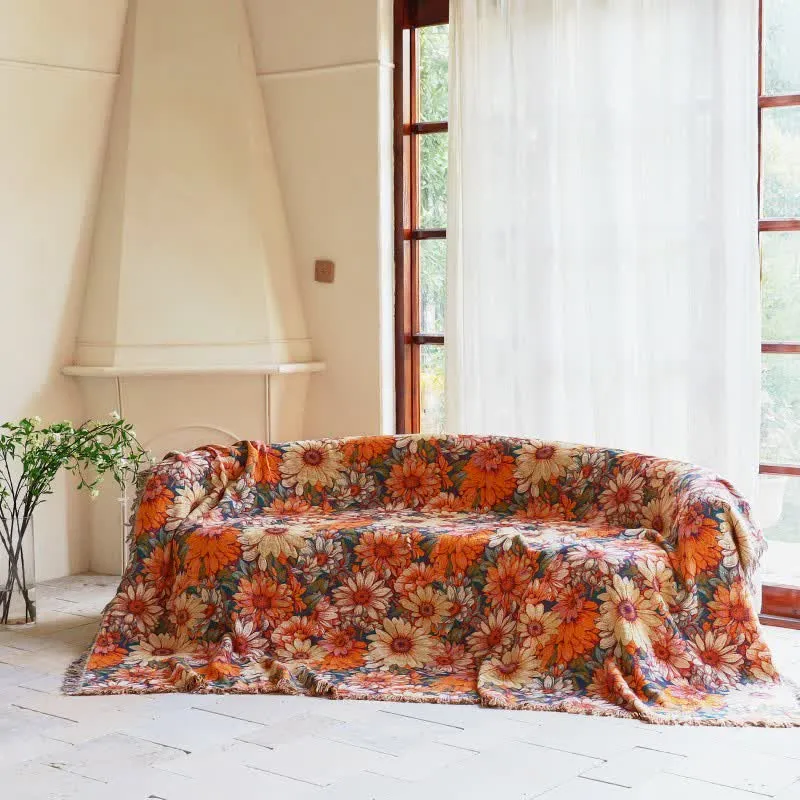 Sofadecke aus Baumwolle mit Sonnenblumenmuster und Quasten