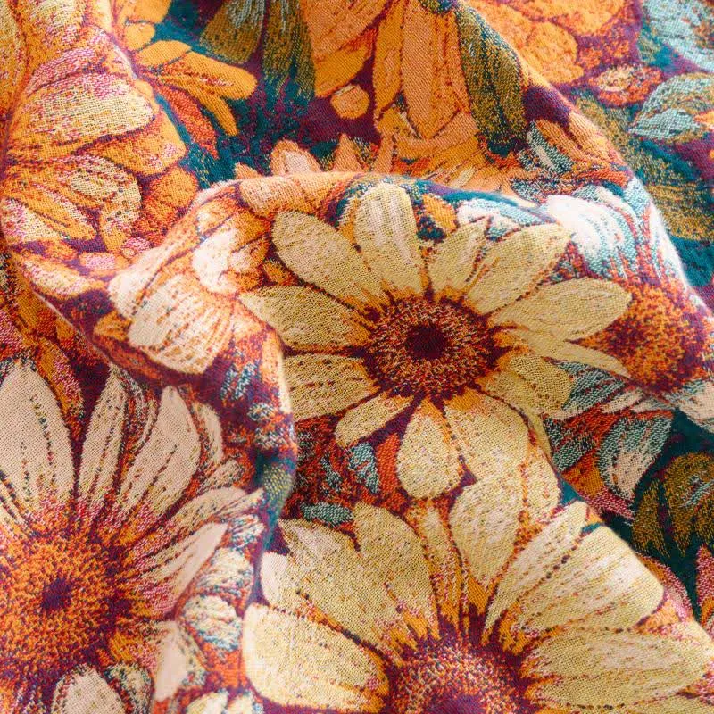 Sofadecke aus Baumwolle mit Sonnenblumenmuster und Quasten