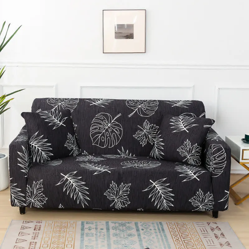 Schwarzer Stretch-Sofabezug mit Monstera-Print