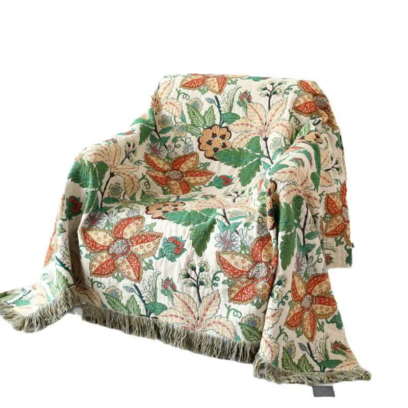 Wendesteppdecke aus Baumwollgaze mit Blumen- und Blattmotiv und Quasten