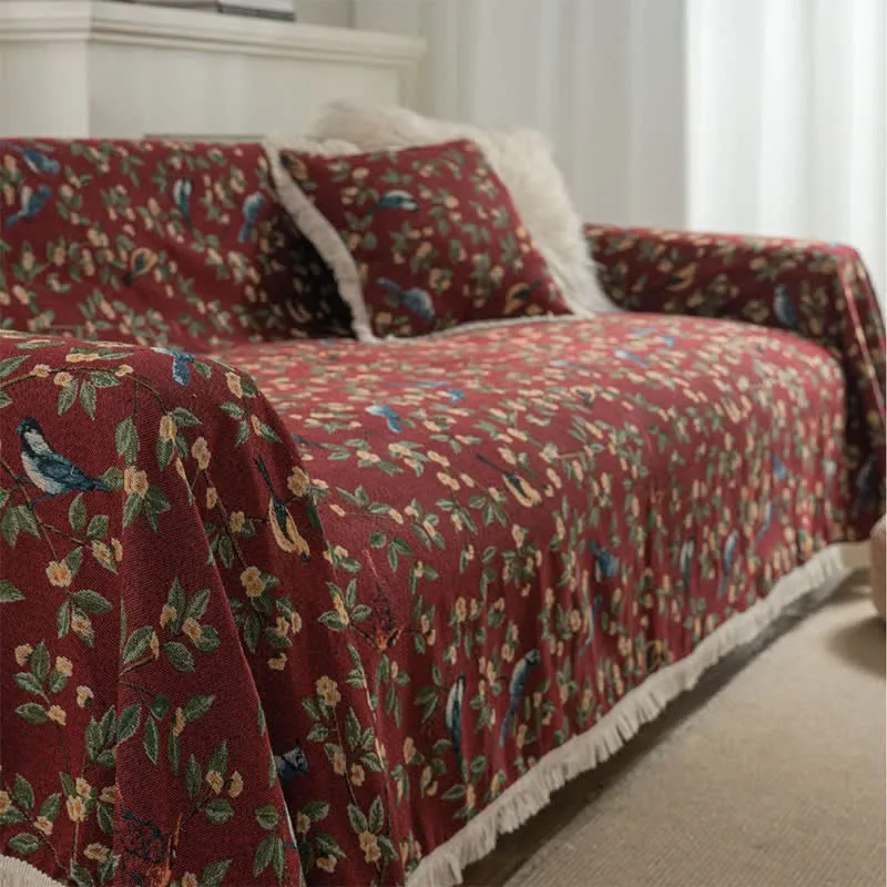 Weicher Sofaschoner mit Quasten und Blumen- und Vogelmotiv