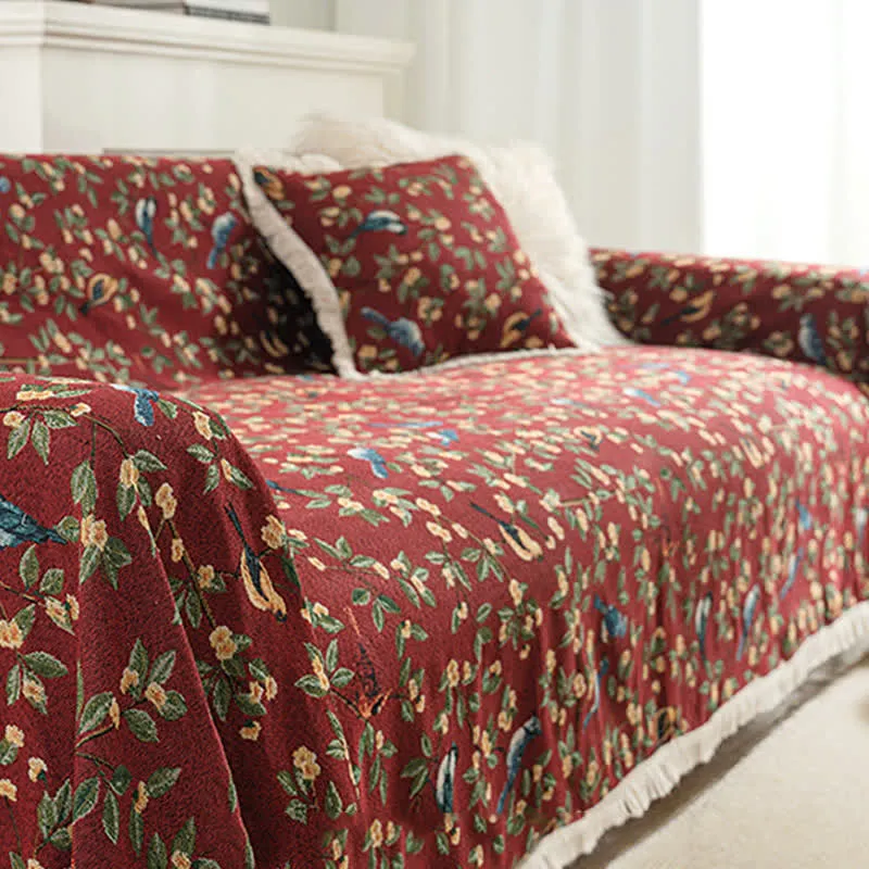 Weicher Sofaschoner mit Quasten und Blumen- und Vogelmotiv