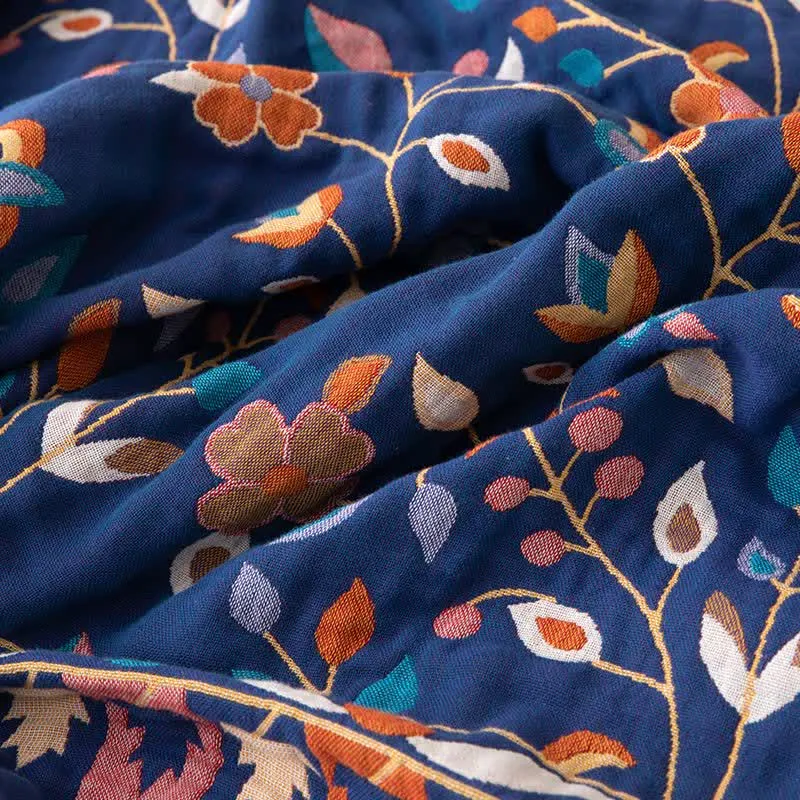 Wendesteppdecke aus Baumwolle mit Vintage-Blumenmuster und Quasten