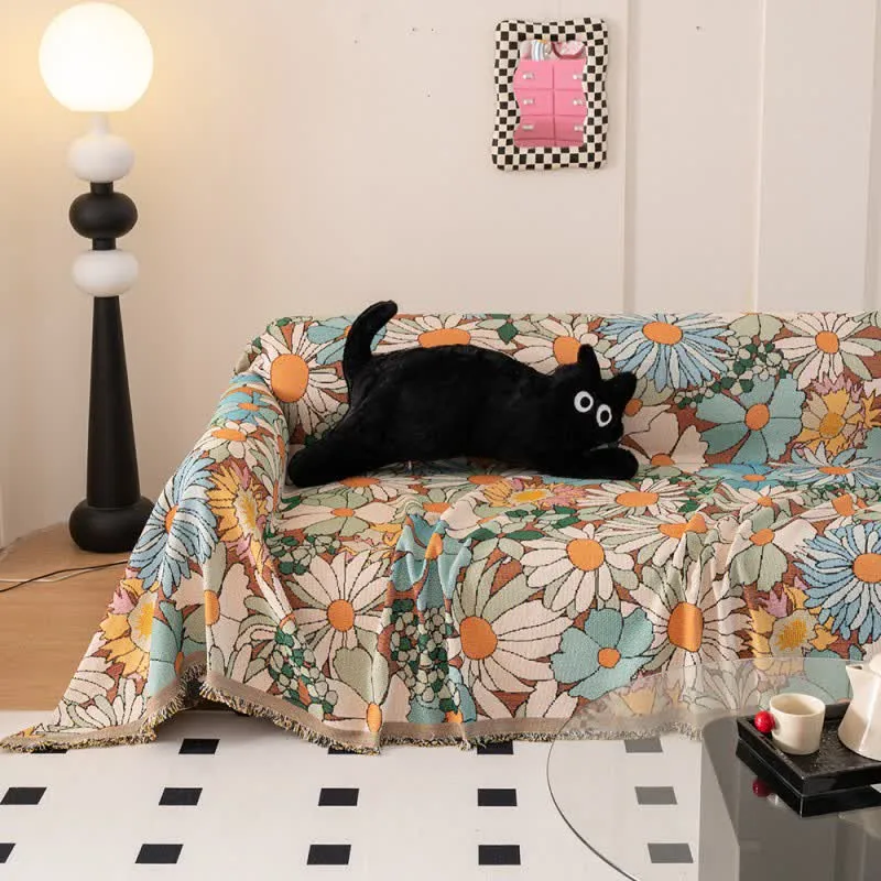 Sofaschoner mit buntem Gänseblümchen-Print