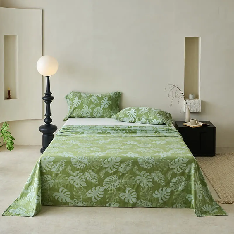 Grüne Tagesdecke aus Baumwollgaze-Jacquard mit Monstera-Motiv