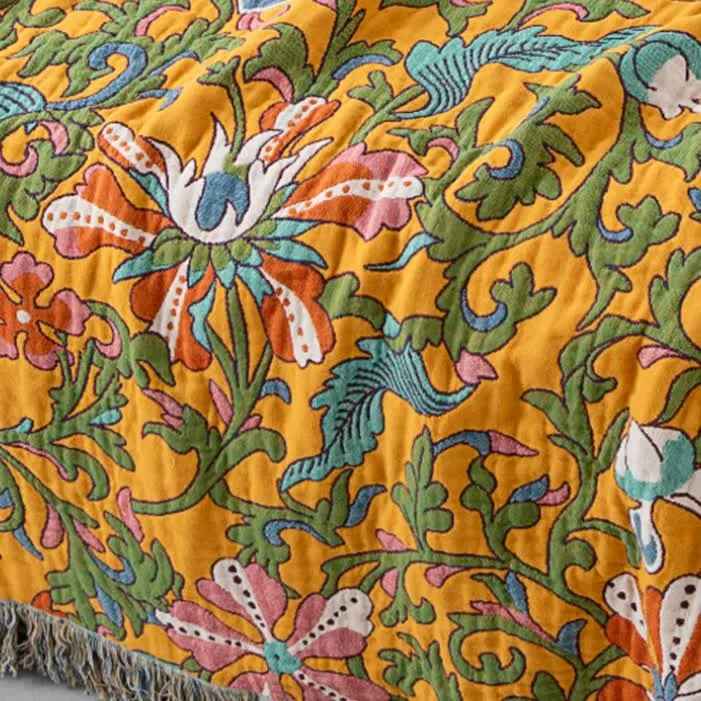 Sofadecke aus Baumwolle mit Vintage-Blumenmuster und Quasten