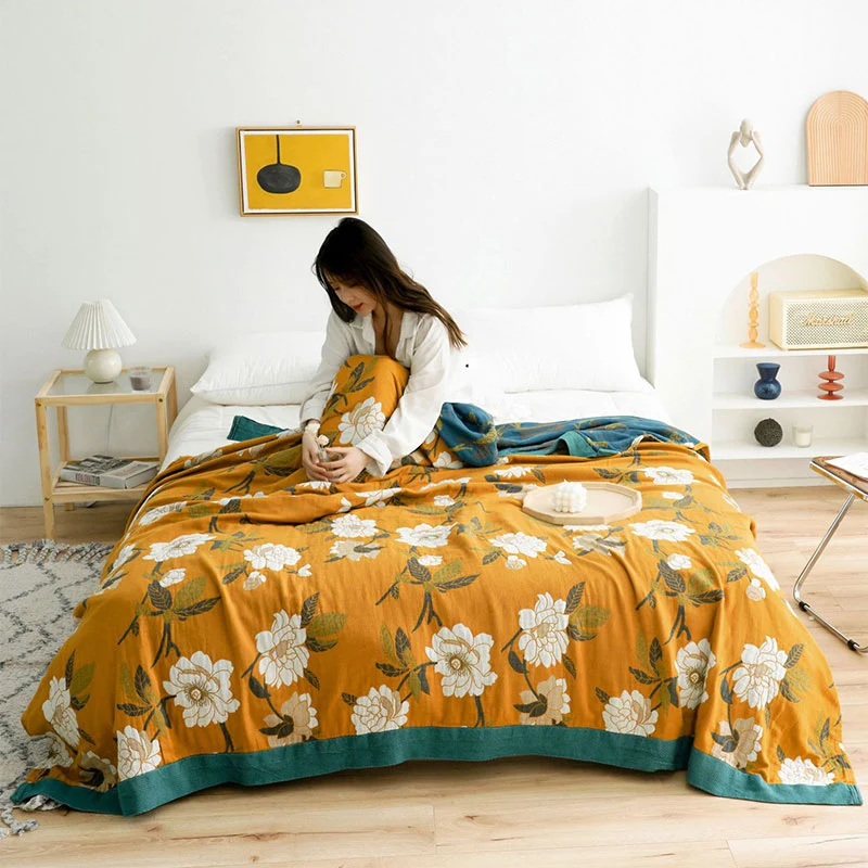 Wendbare Baumwolldecke mit Boho-Blumenmuster in Gelb